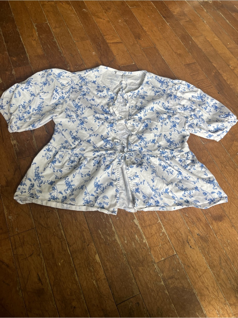 Twik by Simons blue and white floral tie-front blouse in size Medium.